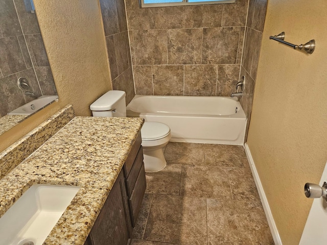 full bathroom featuring tile patterned flooring, vanity, toilet, and tiled shower / bath