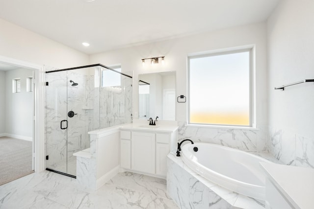 bathroom featuring a garden tub, a marble finish shower, marble finish floor, and vanity