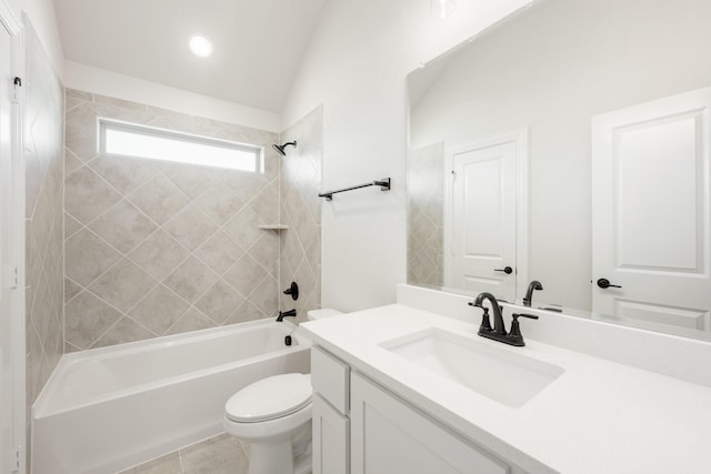 bathroom featuring vaulted ceiling, shower / bathing tub combination, vanity, and toilet