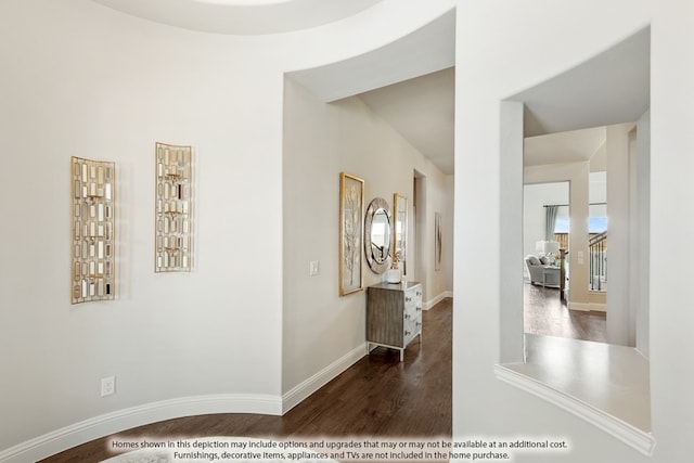 hall with hardwood / wood-style flooring