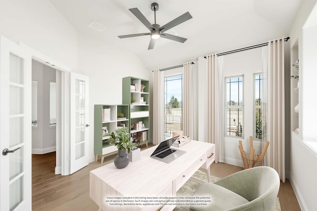 office space featuring a ceiling fan, french doors, light wood-style flooring, and baseboards