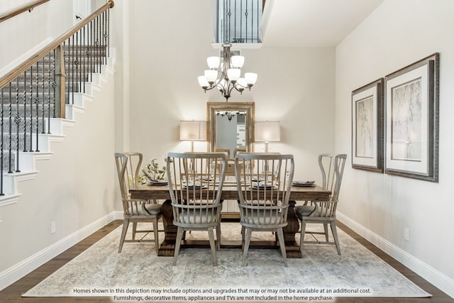 dining area with a notable chandelier and wood-type flooring