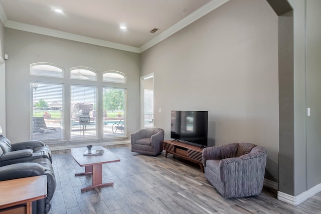 kitchen featuring decorative backsplash, a center island, light stone countertops, and stainless steel appliances