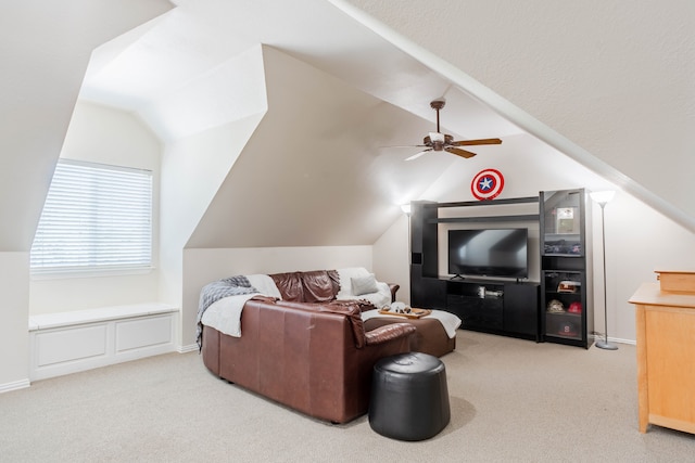 kitchen with lofted ceiling, light carpet, sink, stainless steel dishwasher, and white cabinetry