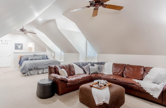 bedroom featuring ceiling fan, light carpet, and vaulted ceiling