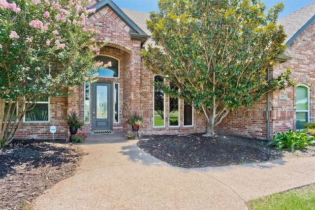 view of front of property featuring a garage and a front lawn