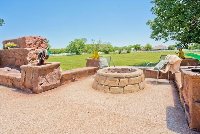 view of patio with an outdoor fire pit