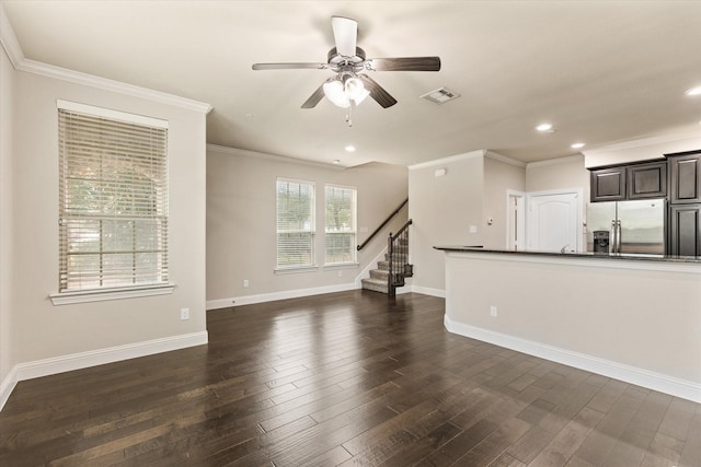 unfurnished living room featuring ceiling fan, crown molding, and dark wood-type flooring