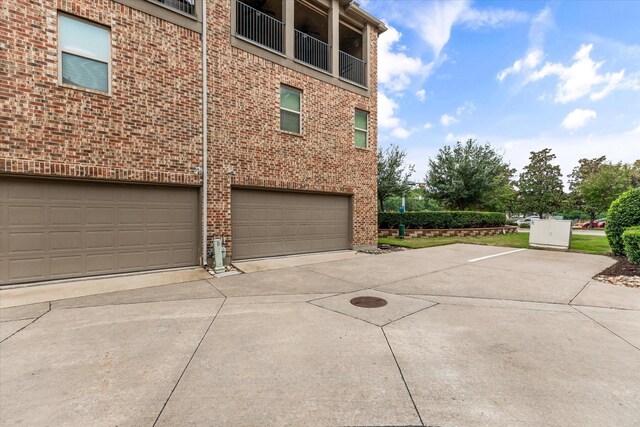 view of property exterior featuring a garage