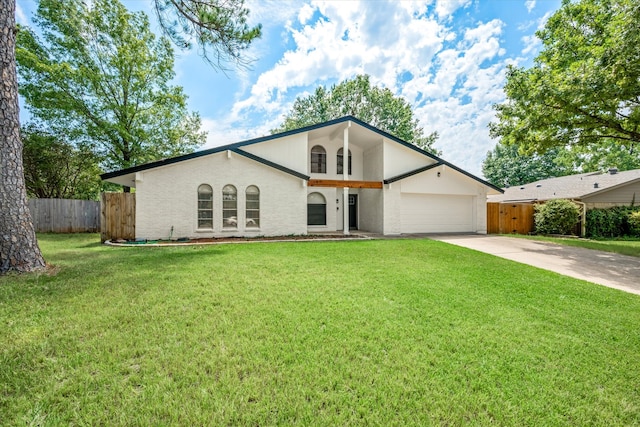 ranch-style house featuring a front lawn and a garage