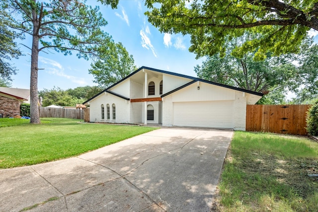 ranch-style home with a front yard and a garage