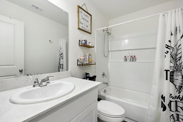 full bathroom featuring shower / bath combo, toilet, and vanity