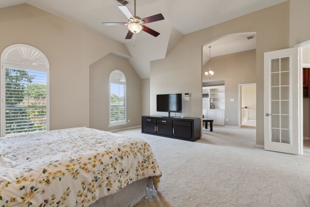 bedroom featuring ceiling fan with notable chandelier, light colored carpet, vaulted ceiling, and multiple windows