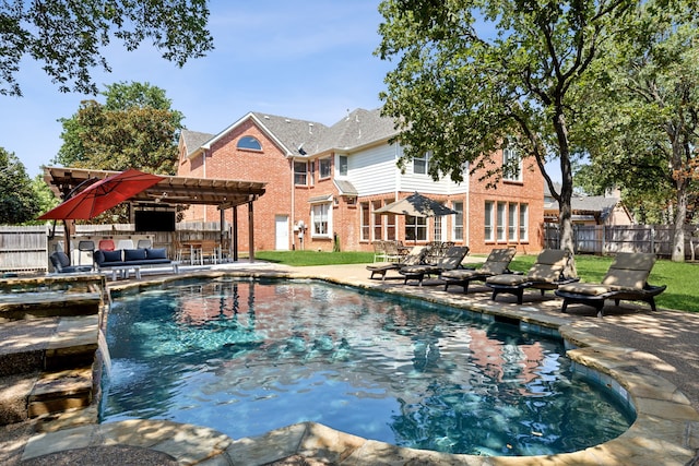 view of pool with outdoor lounge area, a lawn, a pergola, pool water feature, and a patio