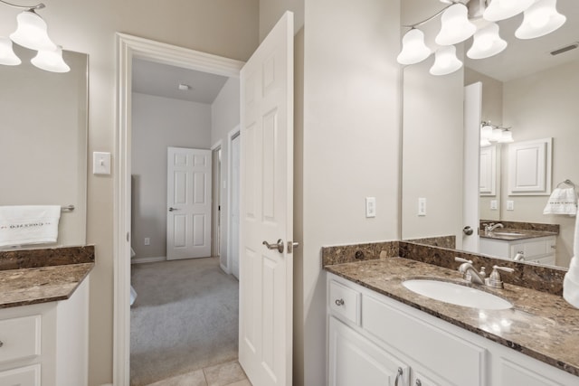 bathroom with tile patterned flooring and vanity