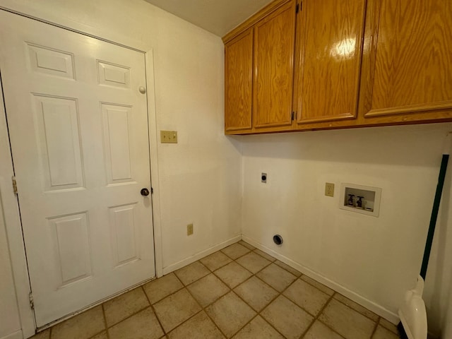 laundry room featuring light tile patterned flooring, hookup for a washing machine, hookup for an electric dryer, and cabinets