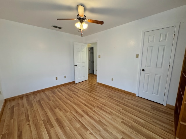 unfurnished room featuring ceiling fan and light hardwood / wood-style flooring