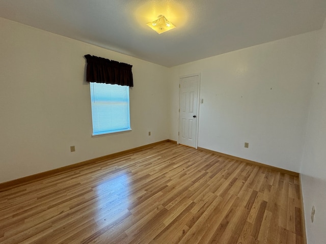 unfurnished room featuring light wood-type flooring