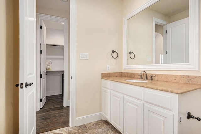 bathroom with vanity and hardwood / wood-style floors