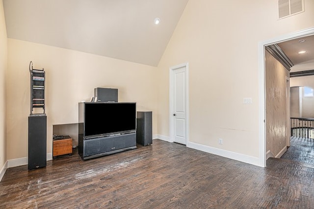 living room featuring dark hardwood / wood-style floors and high vaulted ceiling