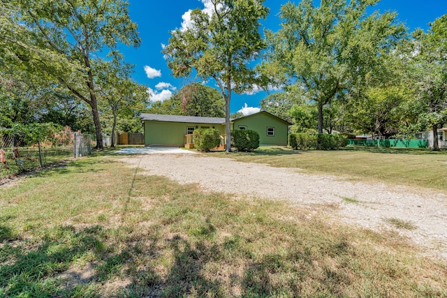 exterior space with driveway and fence