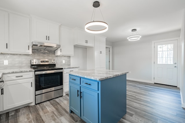 kitchen with decorative light fixtures, light stone counters, light hardwood / wood-style floors, tasteful backsplash, and stainless steel electric range