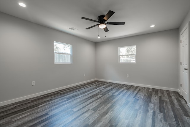 unfurnished room with a wealth of natural light, ceiling fan, and hardwood / wood-style flooring