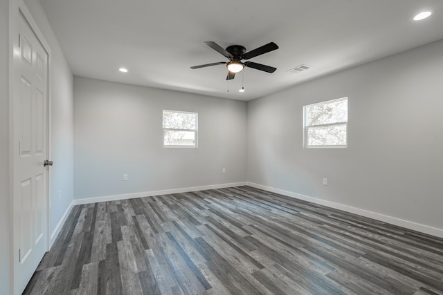 unfurnished room featuring ceiling fan, a healthy amount of sunlight, and hardwood / wood-style floors