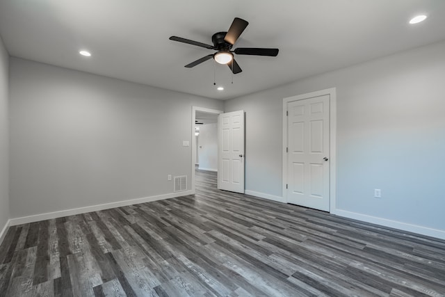 unfurnished bedroom with ceiling fan and hardwood / wood-style flooring