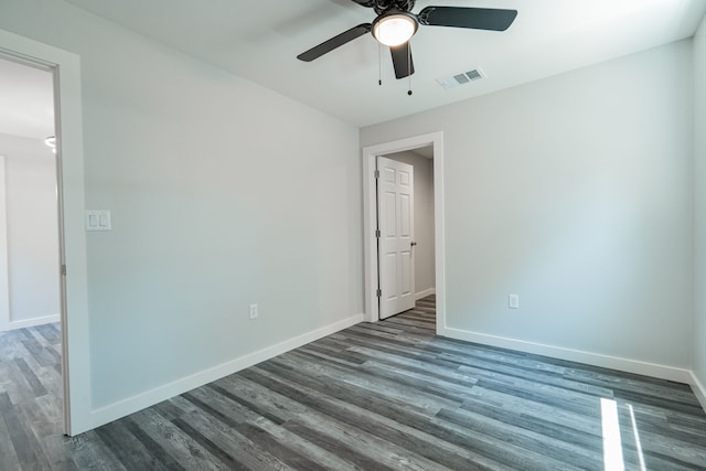 empty room with ceiling fan and wood-type flooring