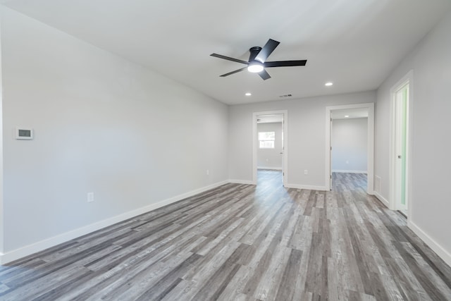 unfurnished bedroom with ceiling fan and hardwood / wood-style floors