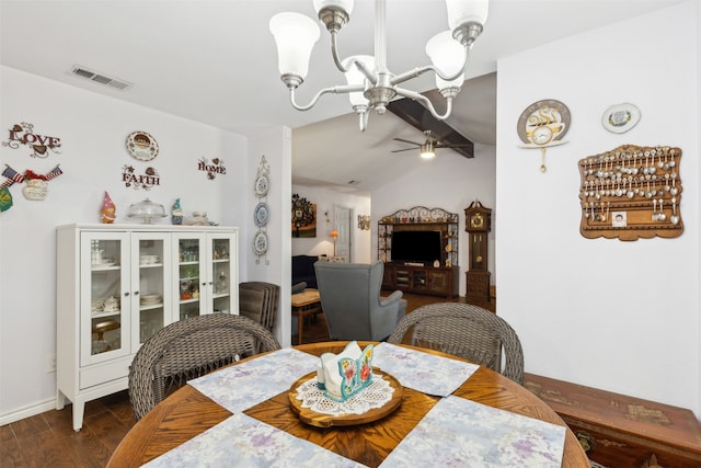 dining area featuring lofted ceiling, ceiling fan with notable chandelier, hardwood / wood-style floors, and french doors