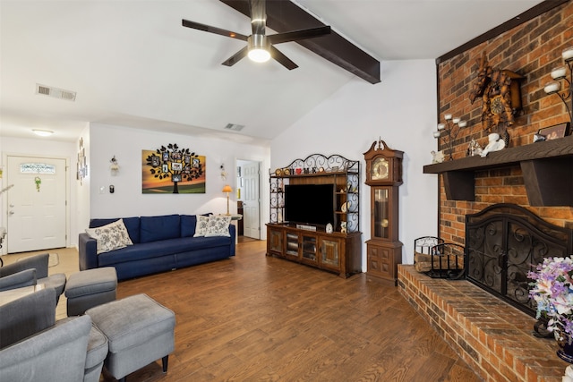 living room featuring ceiling fan, a fireplace, vaulted ceiling with beams, and wood-type flooring