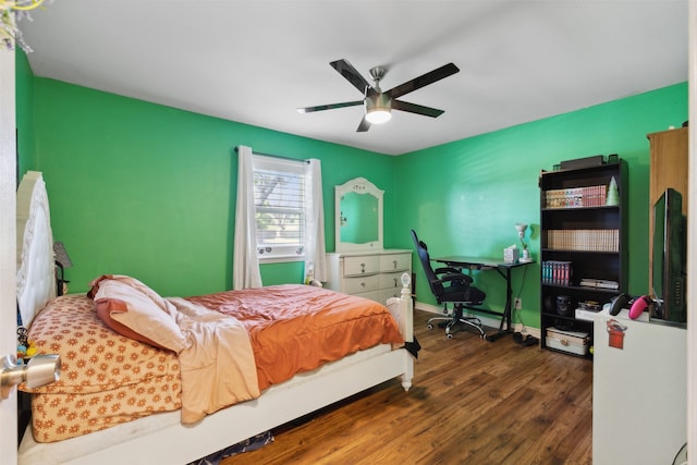 bedroom featuring ceiling fan and dark hardwood / wood-style floors