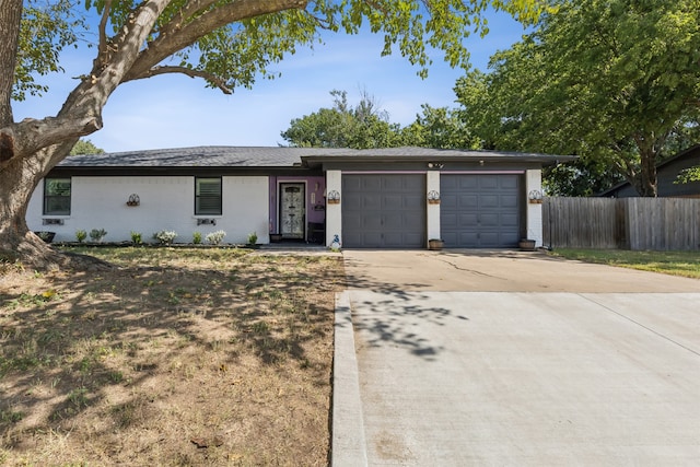 single story home with a garage