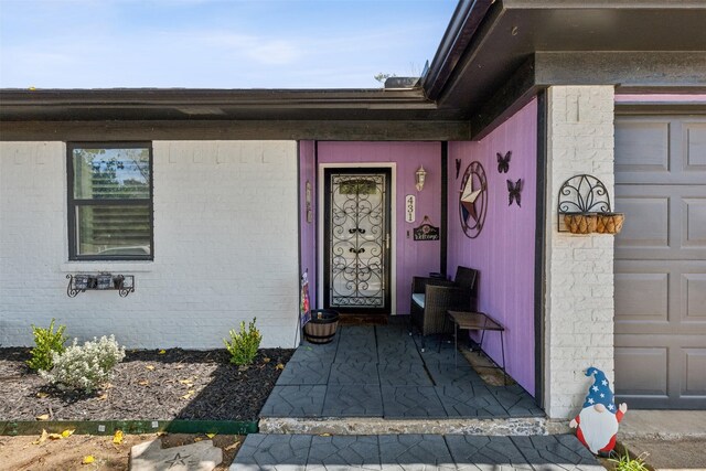 property entrance with a garage