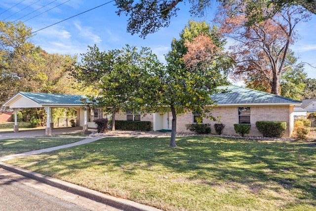 view of front of house with a front lawn and a carport