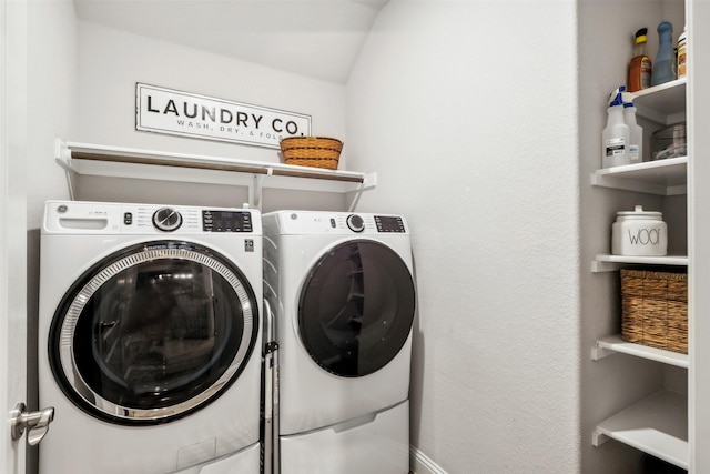 laundry room featuring washer and clothes dryer