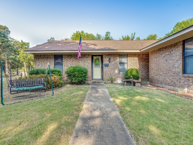 ranch-style house with a front lawn