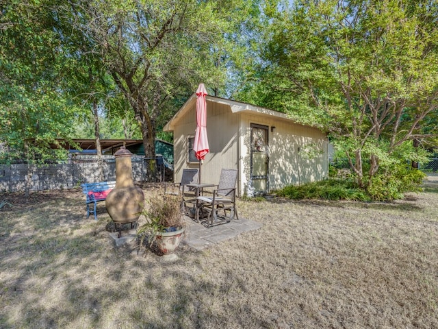 exterior space with a patio and a fire pit