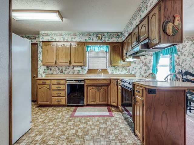 kitchen with dishwasher, sink, electric range oven, kitchen peninsula, and white fridge