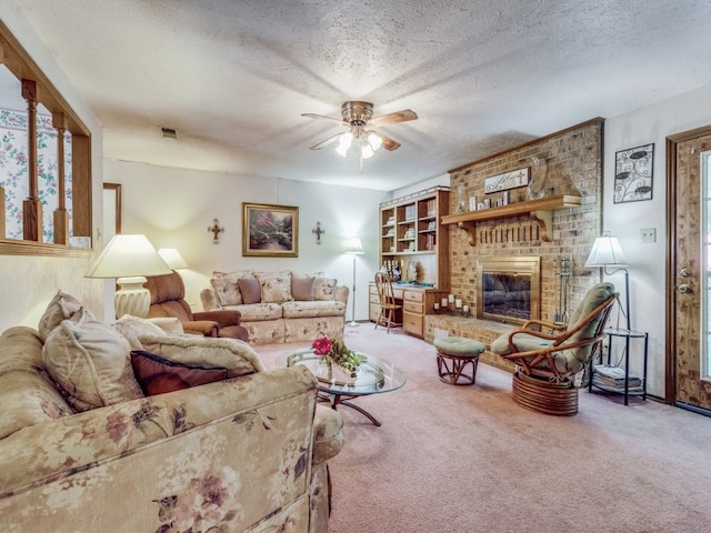 carpeted living room with a textured ceiling, ceiling fan, and a brick fireplace