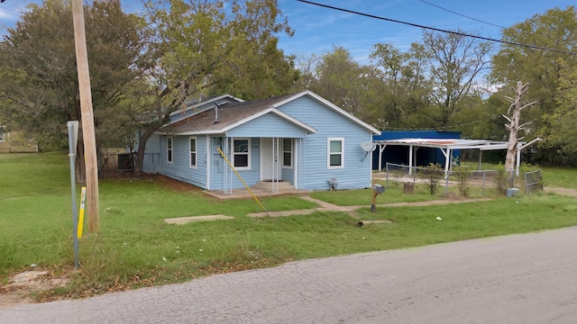 bungalow-style home with a front lawn