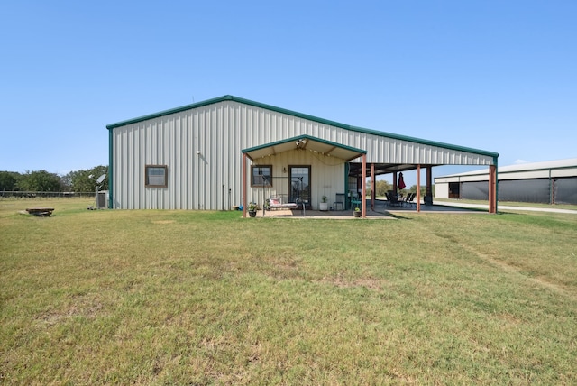 view of outbuilding featuring a yard