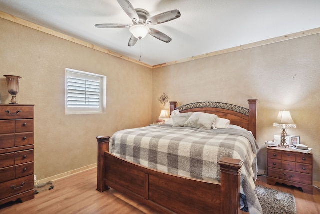 bedroom featuring ceiling fan and light hardwood / wood-style floors