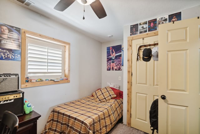 carpeted bedroom with ceiling fan