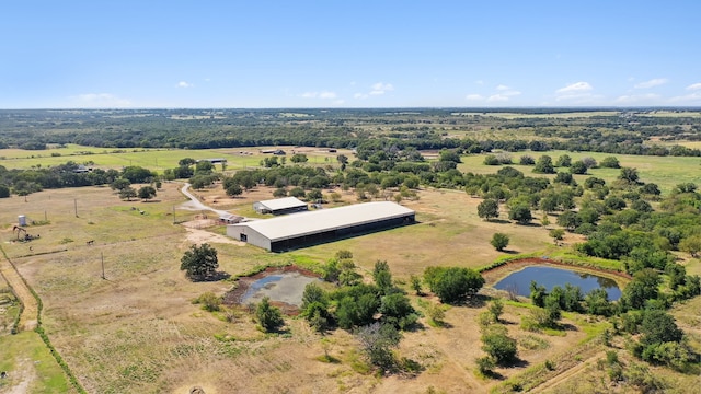 birds eye view of property featuring a rural view and a water view