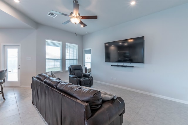 living room with light tile patterned flooring and ceiling fan