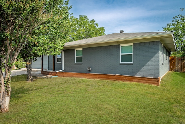 back of house with a yard