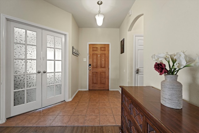 tiled entryway with french doors